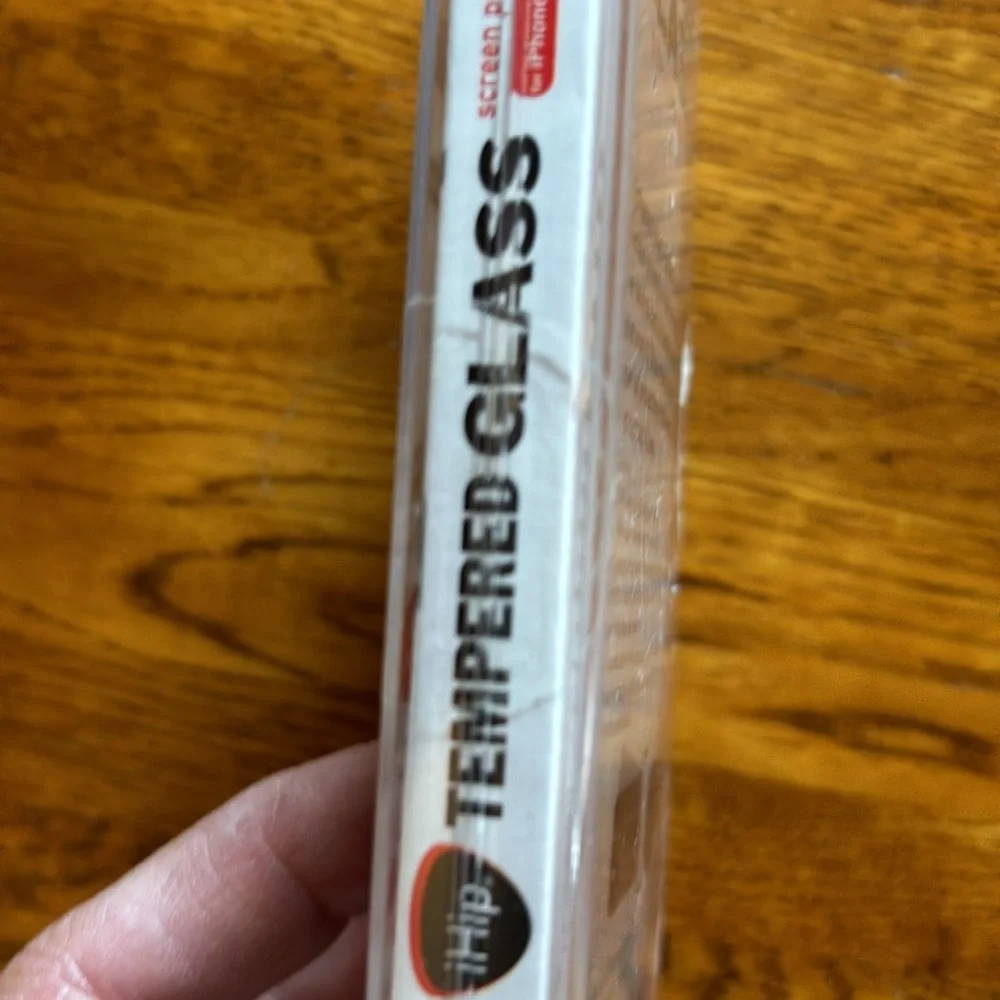 NWT. (New with tape intact). Never opened. Tempered glass iPhone 6/6s